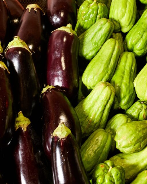 Eggplant you know. Chayote – maybe not yet.
Mild, crisp, somewhere between a cucumber and a zucchini. It braises beautifully, takes on flavour generously, and has been a staple in Vietnamese and Asian kitchens for generations. 
Both worth taking home.

Take her pick. · Tetra Fresh Grocer · Market Square, Sunnybank · 7am–10pm daily.